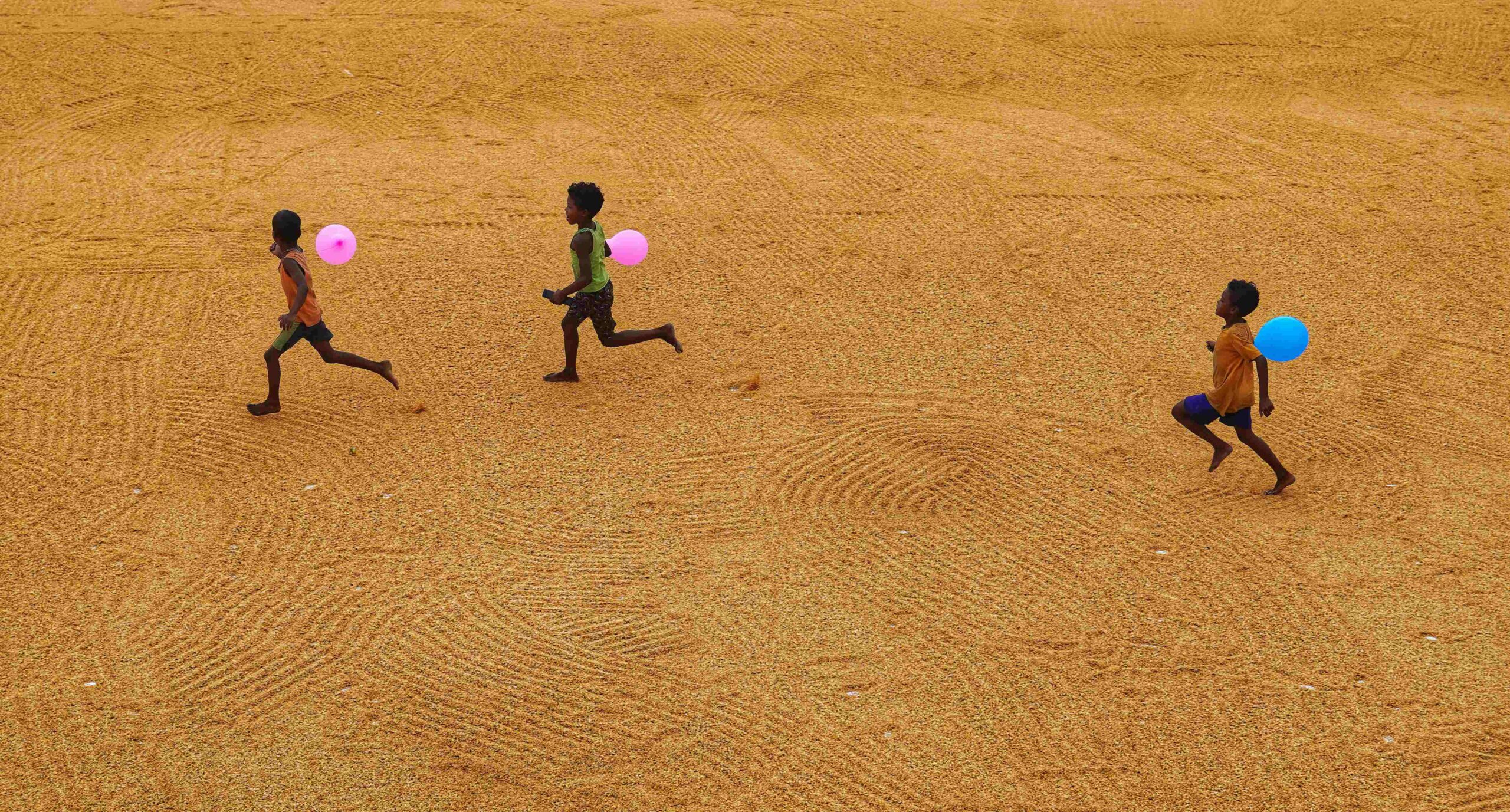 three children running