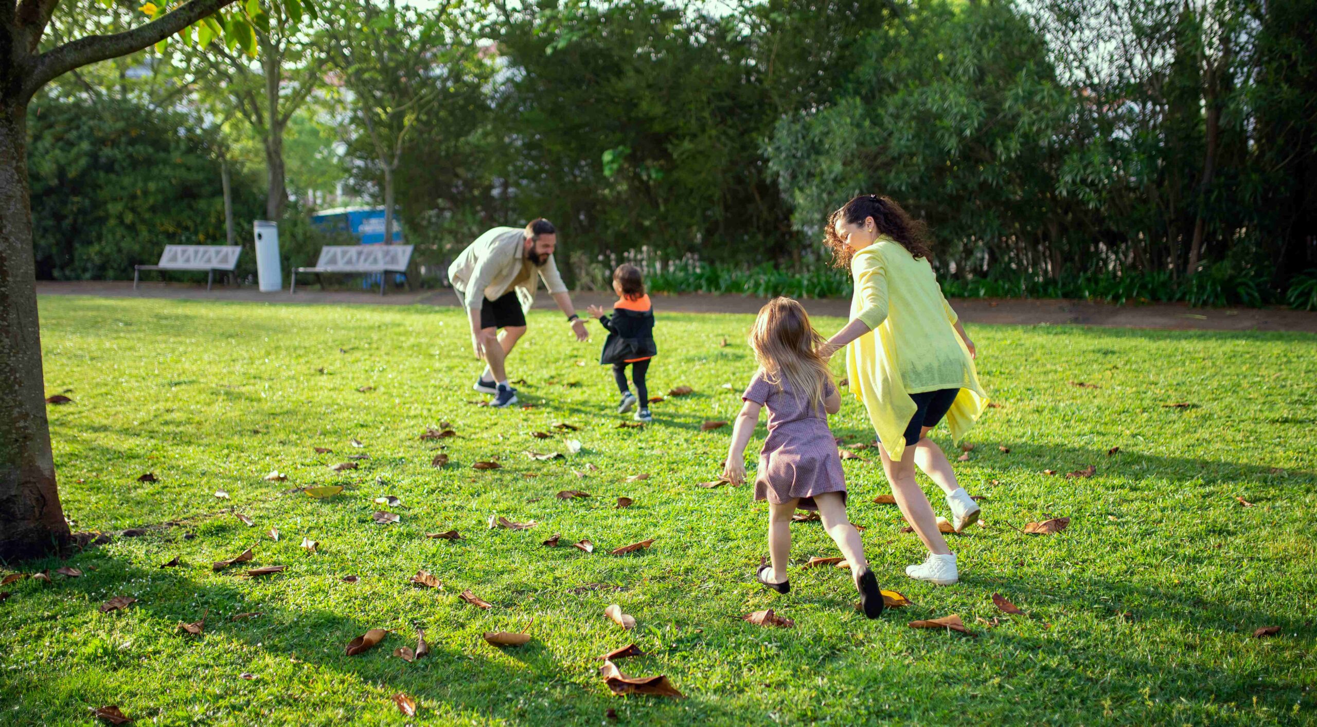 a family playing in a park
