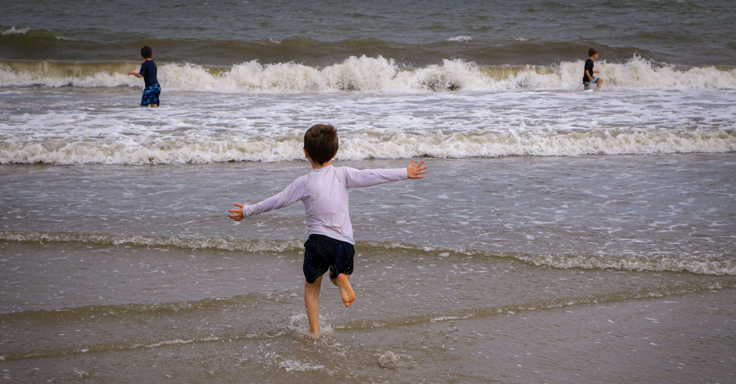 a child running into the sea
