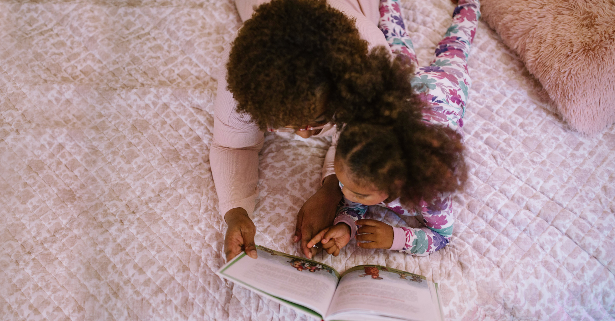 mother and child reading book together
