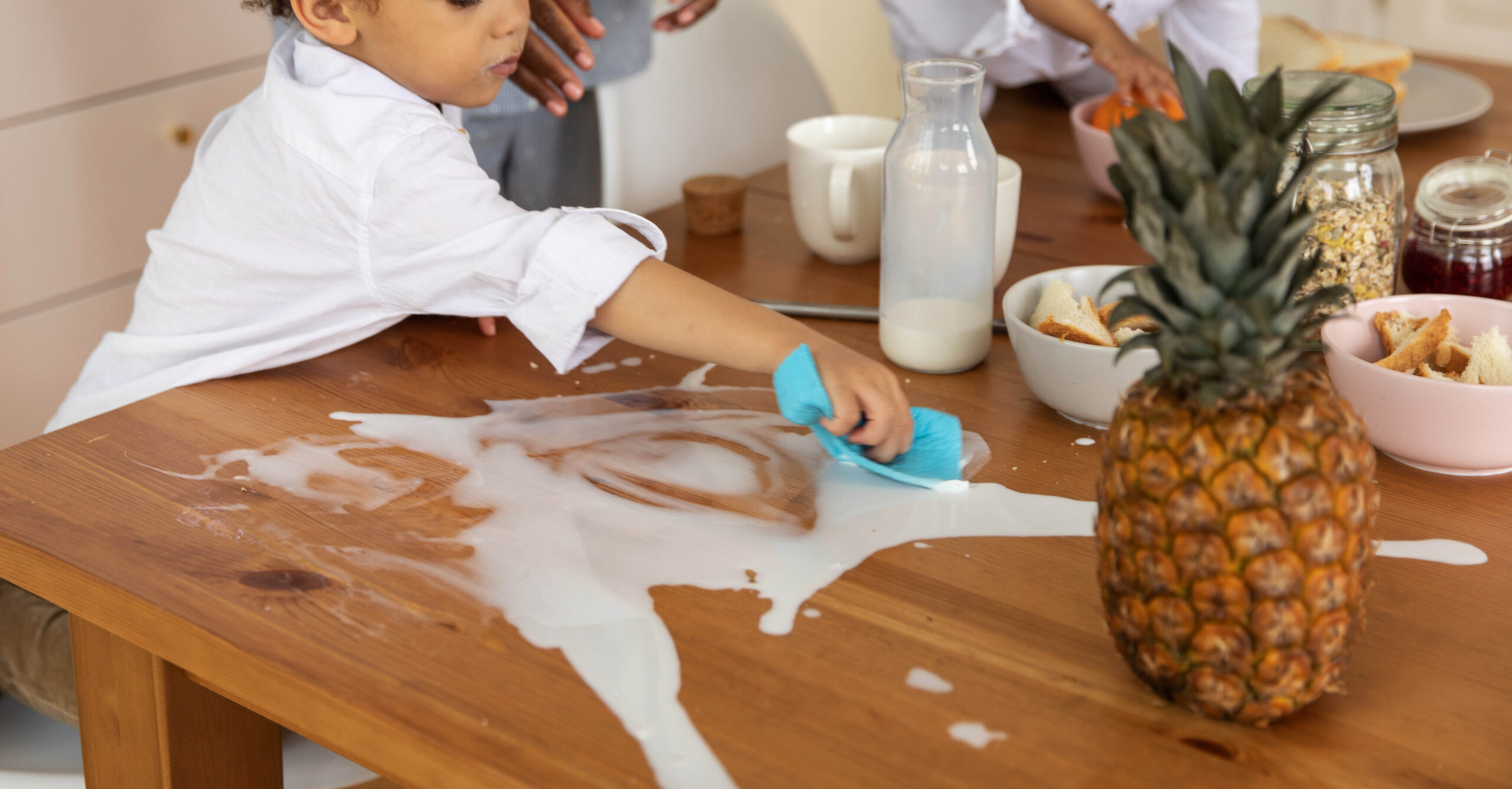 a child cleaning up spilt milk
