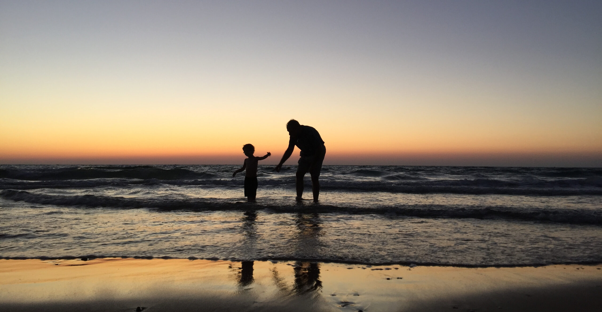 parent and child in the sea