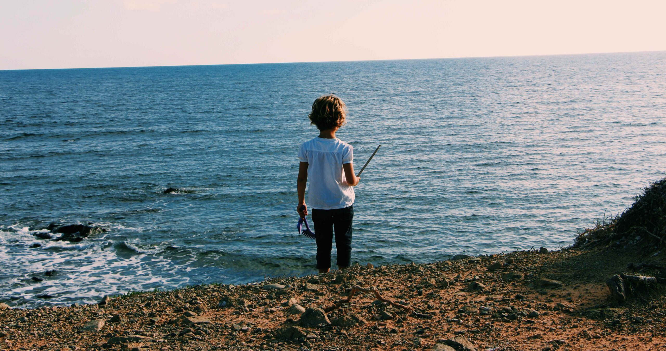 a child looking out to sea