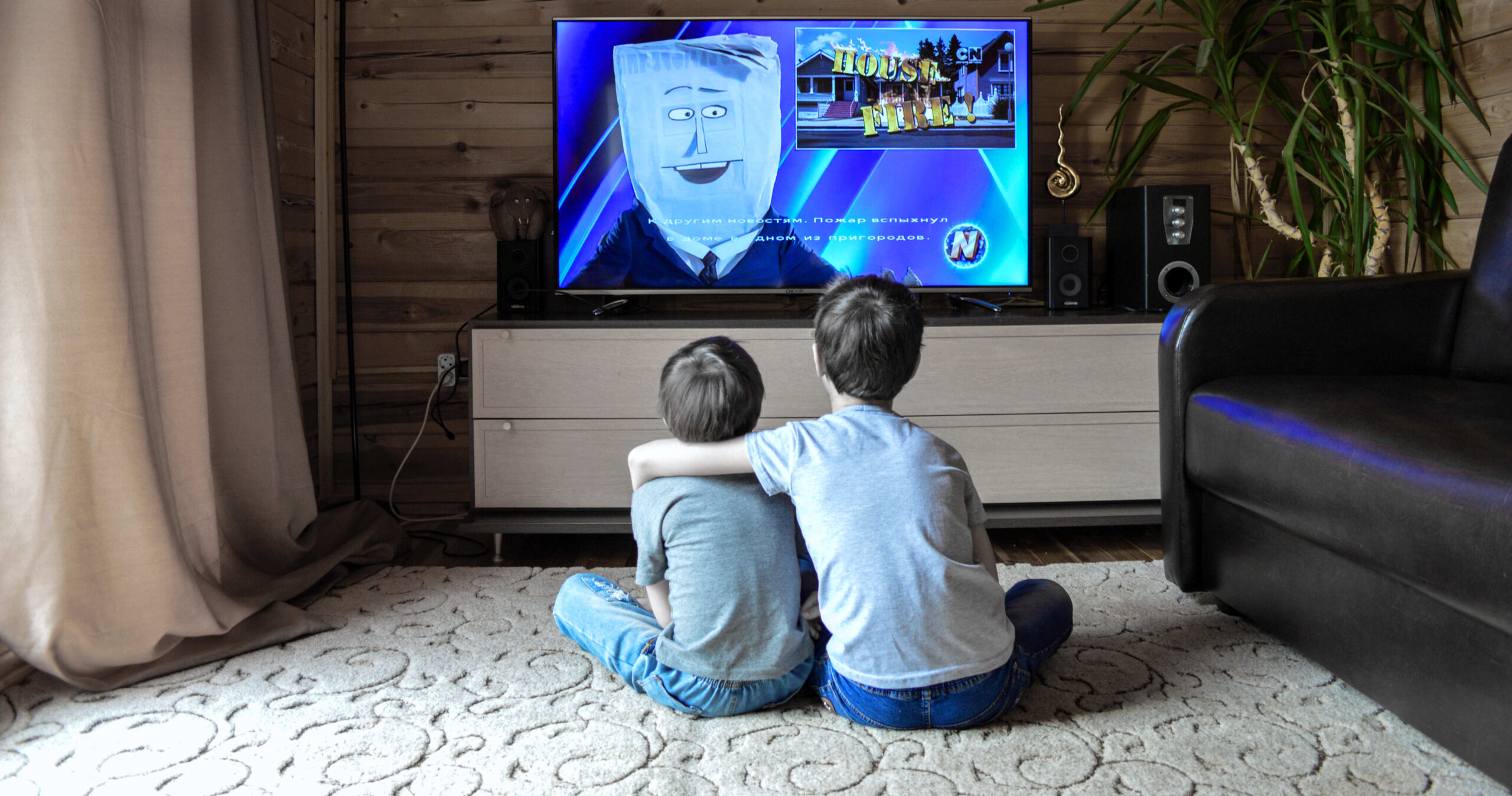 two children watching TV