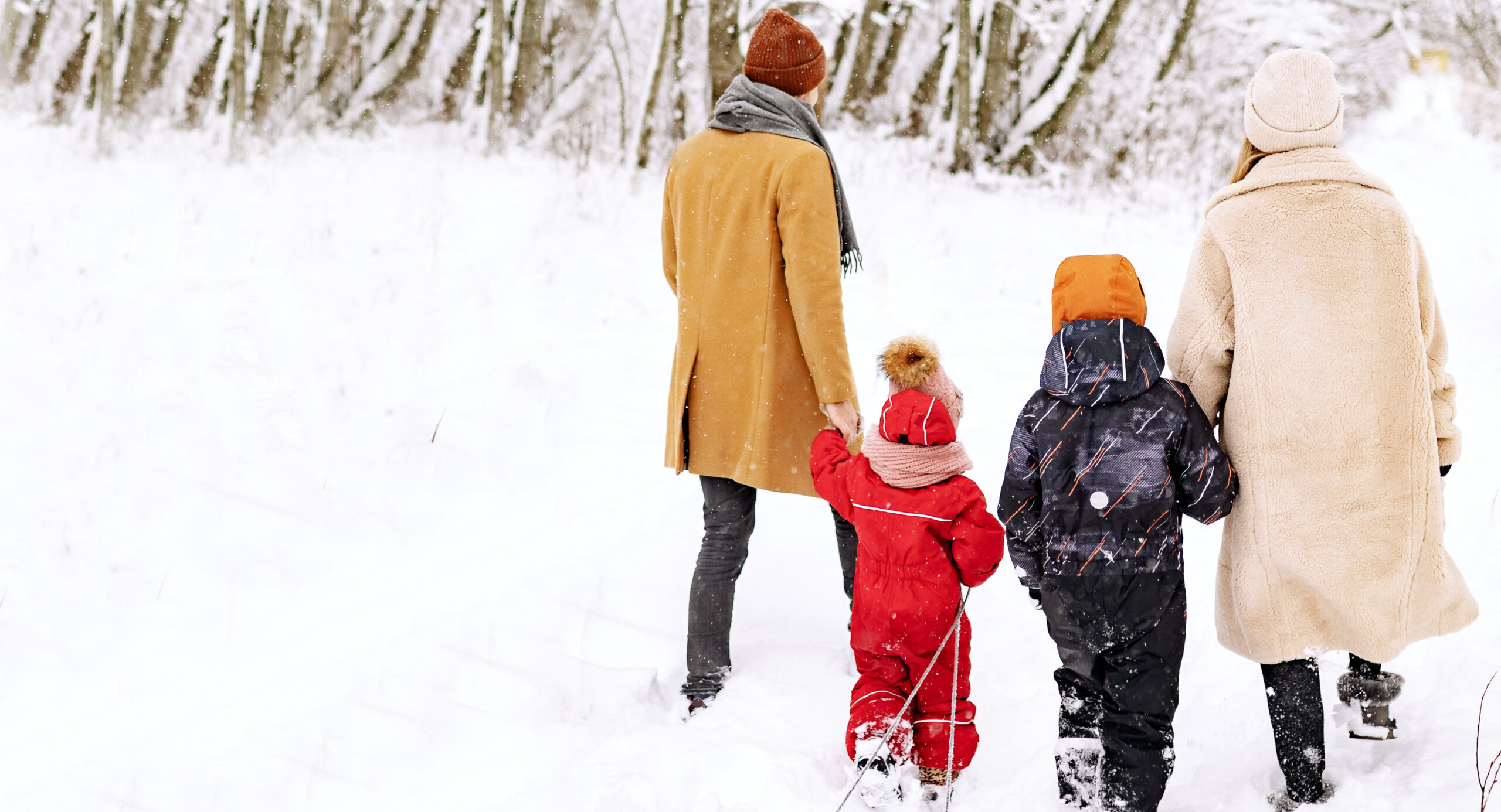 a family walking in the snow
