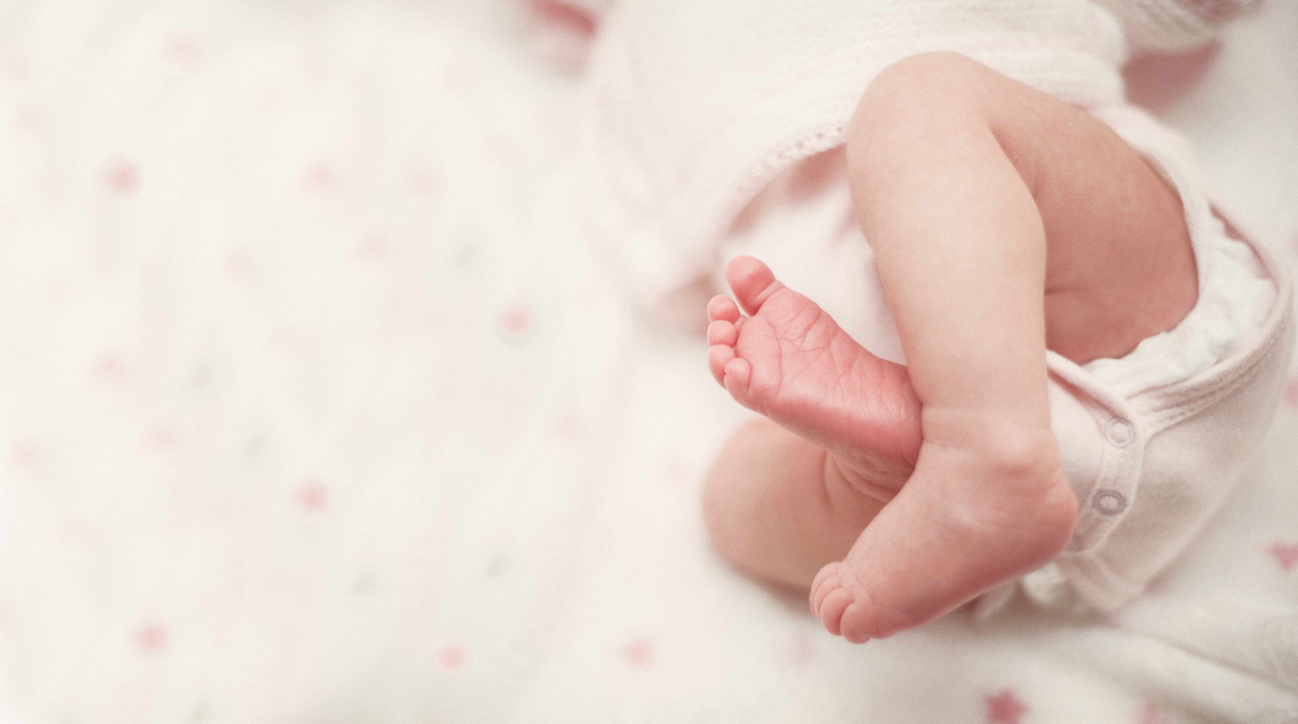 a baby's feet and lower legs