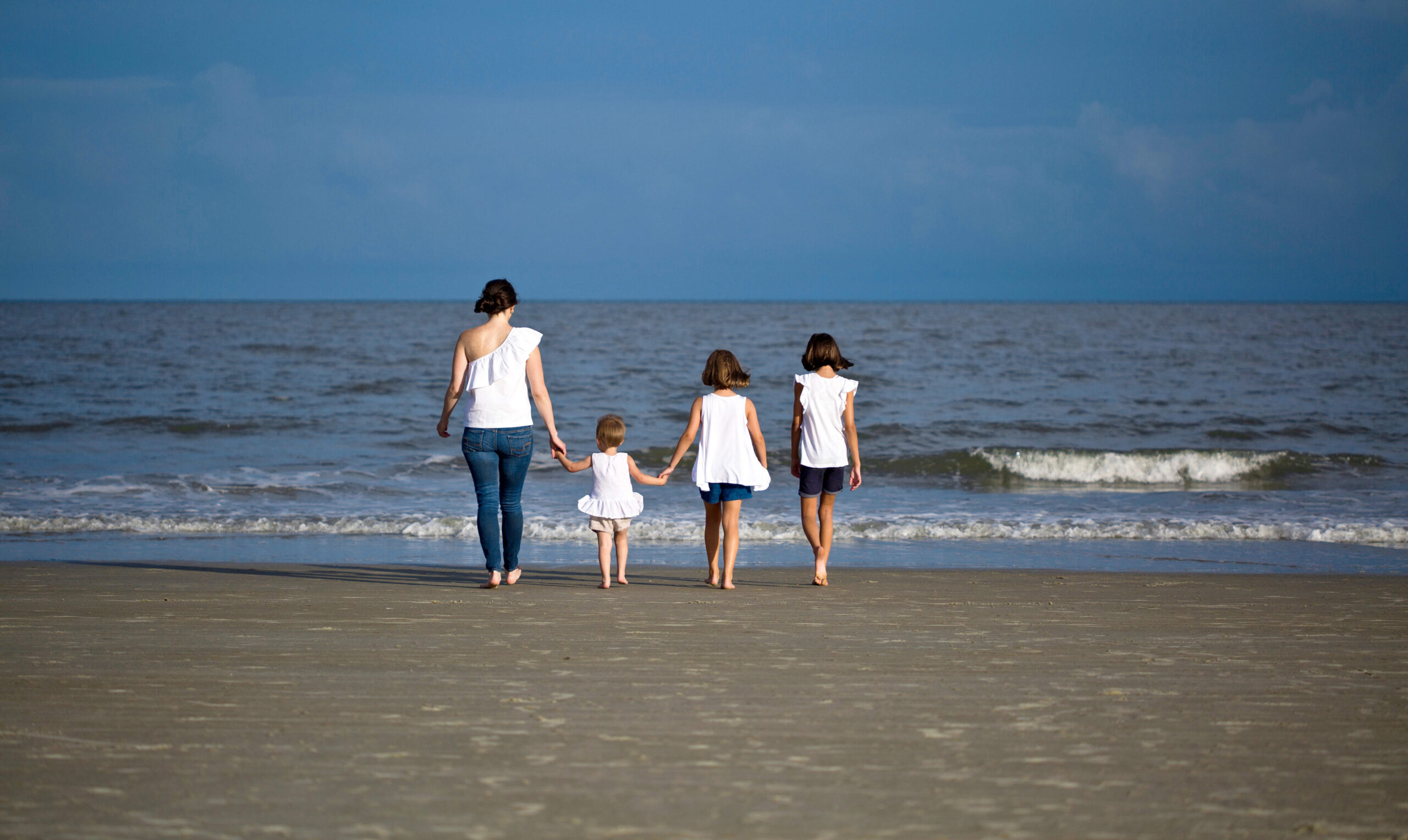 a family on the shoreline
