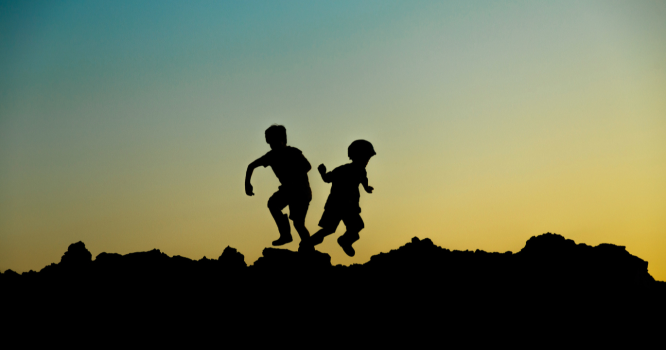two active children at sunset