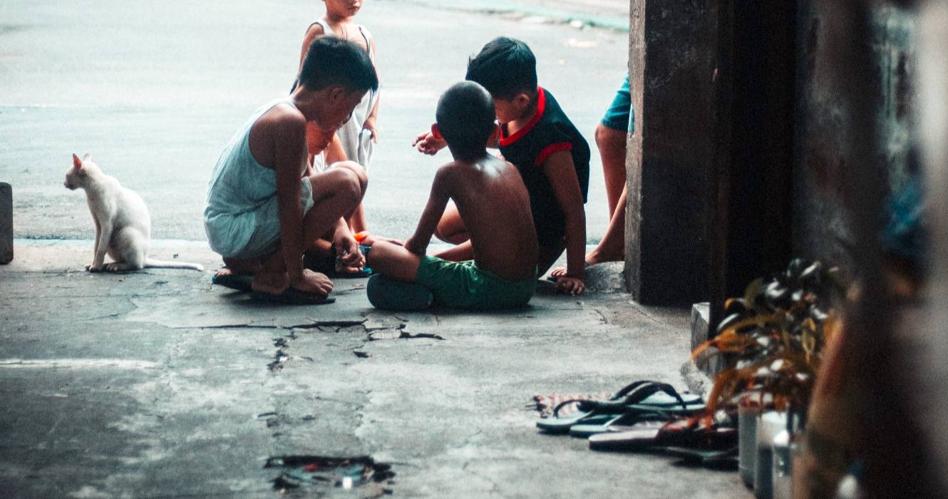 children squatting on the ground