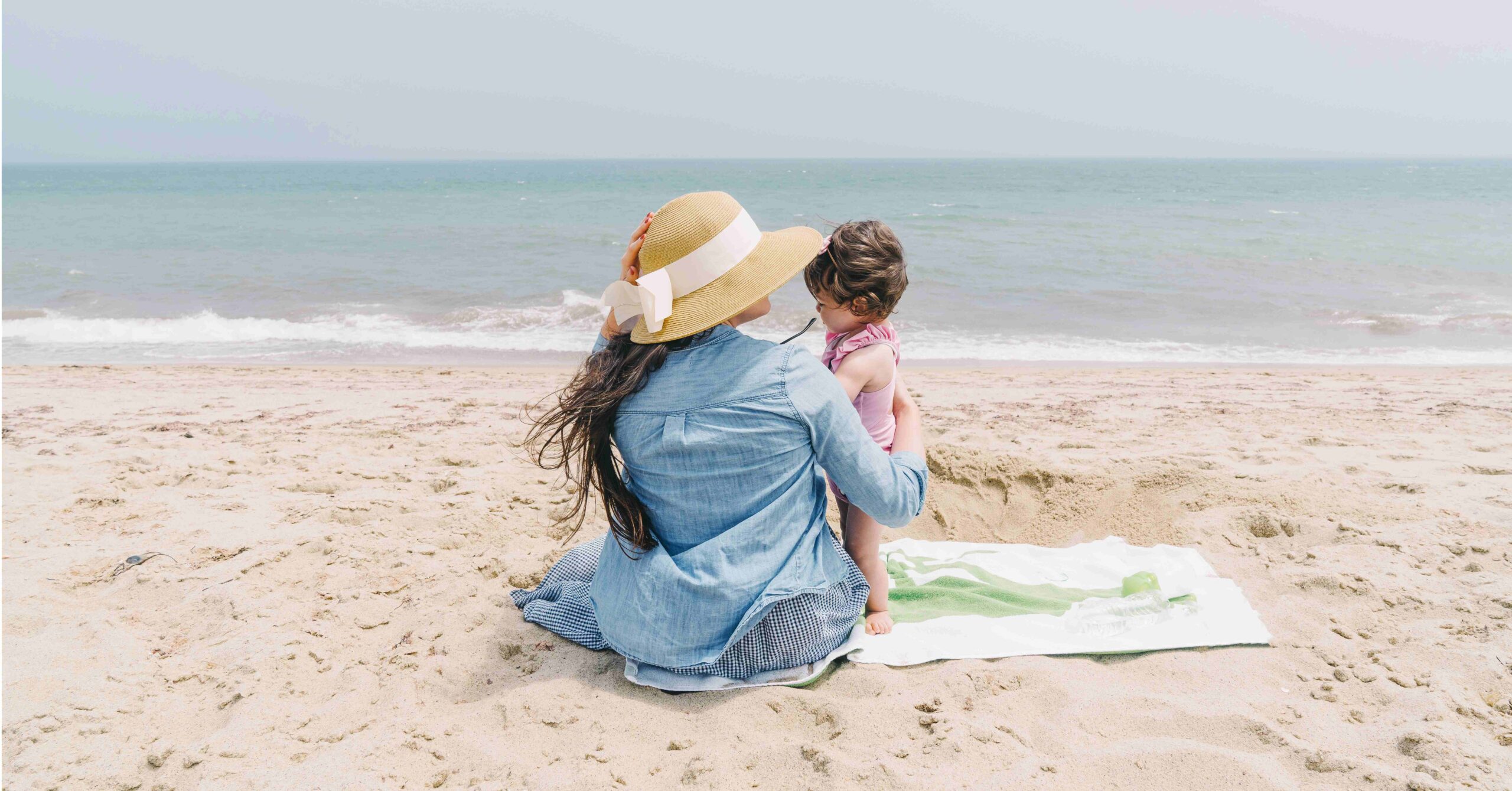 mother and child on beach